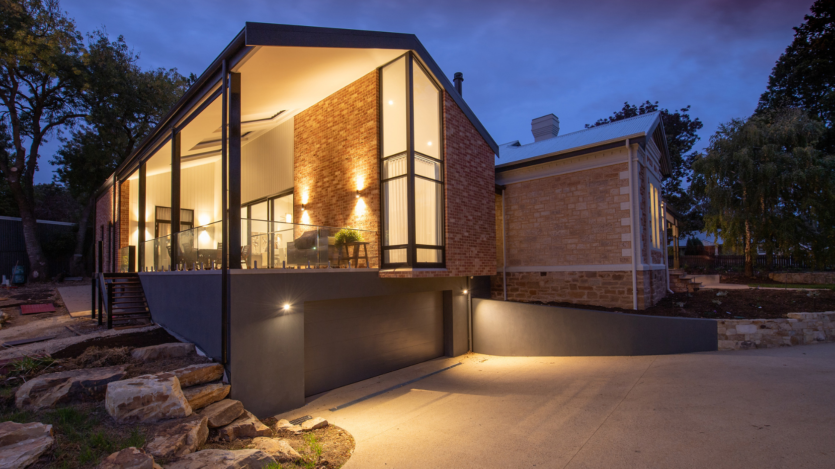 A house with a lot of windows at night